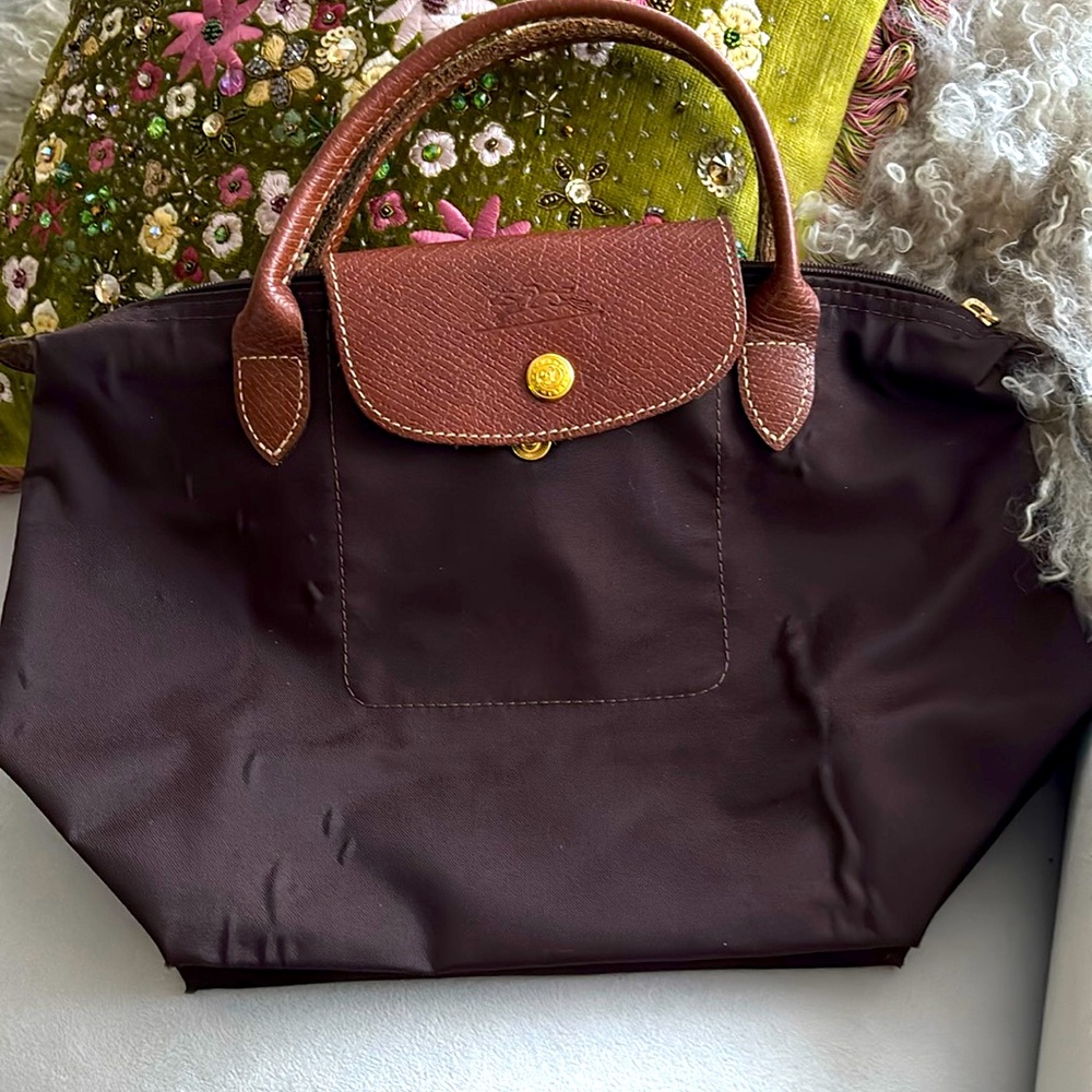 Longchamp brown small please notice the wrinkles on fabric.